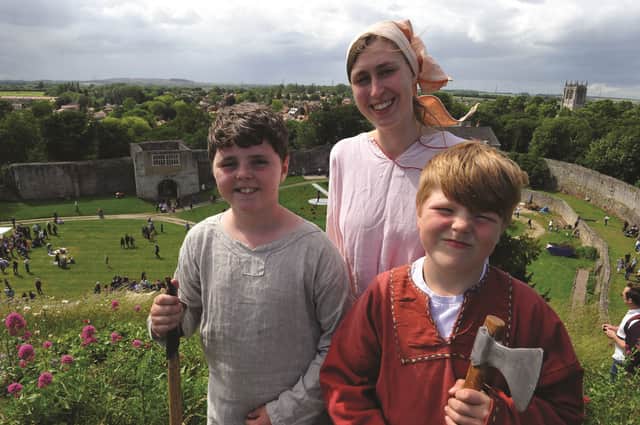 William Stubbins, Florence Oxley and Lewis Smith on top of the old castle Motte. 170972-1
