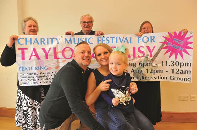 Festival committee members, (from left to right), Cllr Gill Shaw, Cllr Peter Blanksby and Cllr Wendy Fowkes with Daisy Garforth, dad, Lee and mum, Hollie. 171296-4