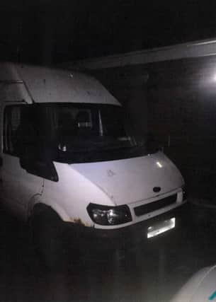 The white van parked up near McColls which police found with stolen goods in.
