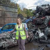 Cllr Hoddinott with a vehicle crushed last year.