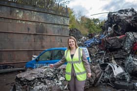 Cllr Hoddinott with a vehicle crushed last year.