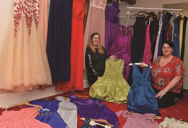 Andrea Jenkinson (left) and Kirstie Pink pictured with some of the prom dresses which they will be giving away for a donation to the Teenage Cancer Trust