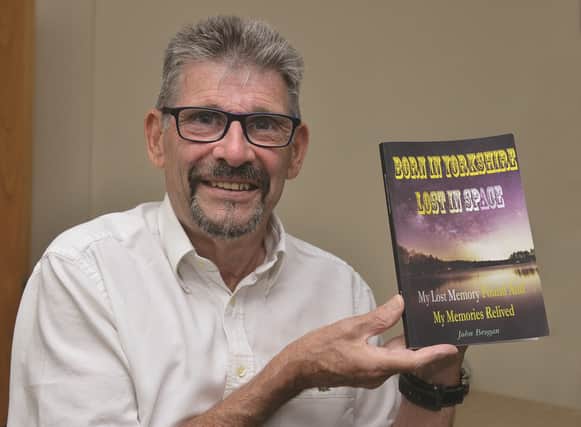 John Brogan with his book Born in Yorkshire, Lost in Space