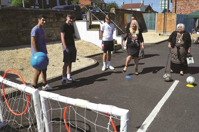 The Mayor ands Mayoress of Rotherham, Cllr jenny Andrews and Cllr Jeanette Mallinder are seen showing their football skills with students (left to right) Ali Said Abdelkadir, Jacob Houlton and Tom Watson.