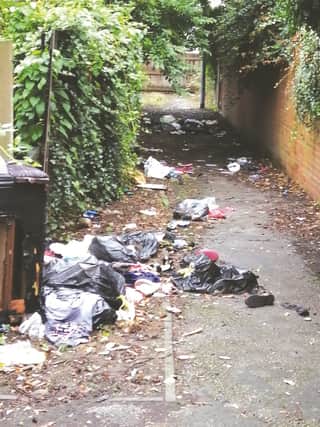 A litter-strewn pathway in Eastwood
