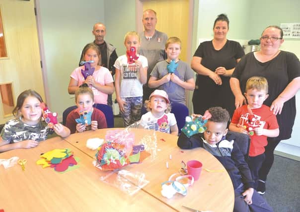 Canklow Kidz has received a PCC grant for £900 for craft supplies. Pictured with some of the youngsters who attend the club are (from left to right): resident DJ John Allen, club secretary Simon Newton, treasurer Tracey Ellis and chairam Emma Barratt. 191266-1
