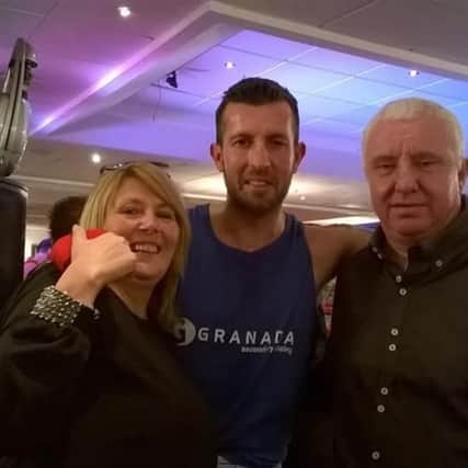 Andy Wilson-Storey (centre) with mum Sharron Arthur and dad Paul Arthur at a charity boxing event.