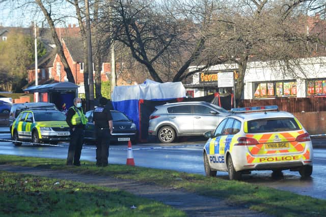 Police on Wath Road after the murder earlier this month