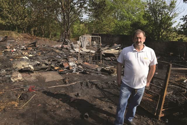 Edwin Ramsbottom shows the arson damage at Clough Nurseries, Masbrough