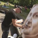 Artist Affix created a spray painted portrait of MP Jo Cox at the recent Great Get Together event in her memory at Clifton Park. 171028-11