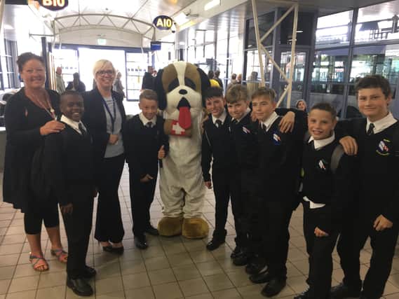 Pictured, staff member Mary Beaumont and headteacher Siobhan Kent at Rotherham Interchange along with pupils and the school’s mascot dog to help ease them into their new commute.
