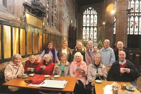 Seen at a recent meeting are members with (back row second left) Joan Maudling, group chairperson and (back row left) Margaret Powell, volunteer. 171644