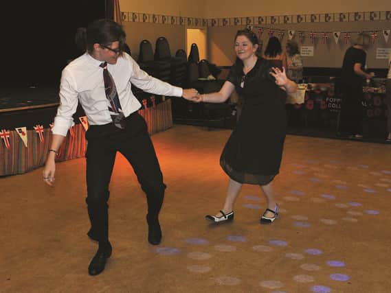 Dave Doyle and wife Krissy giving a Lindy Hop demonstration