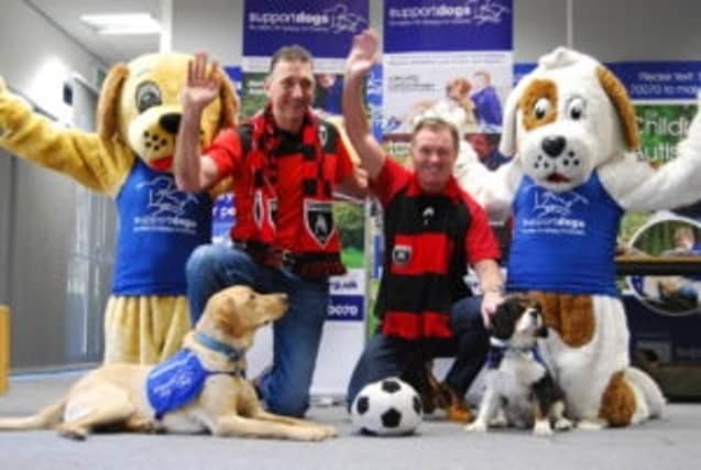 (L-R) Darrell Johnson and Wilf Race from Maltby Main FC with mascots Dandelion and Murdoch.