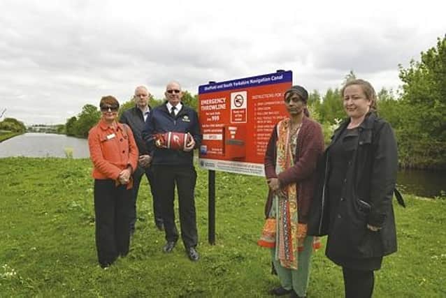 Pictured with the life-saving equipment are (from left to right): Parkgate Shopping centre manager Janet Drury, health and safety advisor for the Canal River Trust Stephen Williamson, water safety practitioner for South Yorkshire Fire and Rescue Gary Willoughby, drowning victim Subhaan Ali’s mum Zaura Ali and DC Victoria Kenny. 180742
