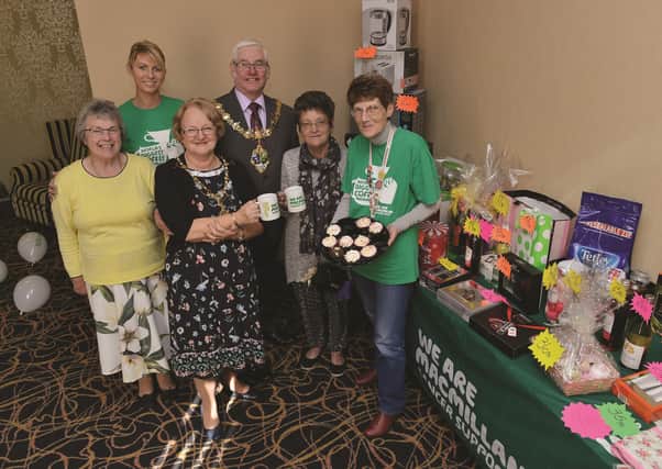 The Mayor and Mayoress of Rotherham Cllr Alan and Mrs Sandra Buckley dropped into the Garden Room at the Town Hall to visit a Macmillan coffee morning hosted by Cllr Rose McNeely in memory of her husband Vince. Rose (right) is pictured with her helpers (from left to right): Winnie Billups, daughter Claire Jasiok and Pauline Heaps. 183446