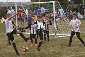 Action involving Treeton Terriers (stripes) at the 30th Summer Tournament at Brinsworth on Saturday. Picture by DAVE POOUCHER