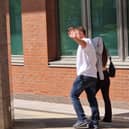 Laura Cunningham left court with an item of clothing over her head