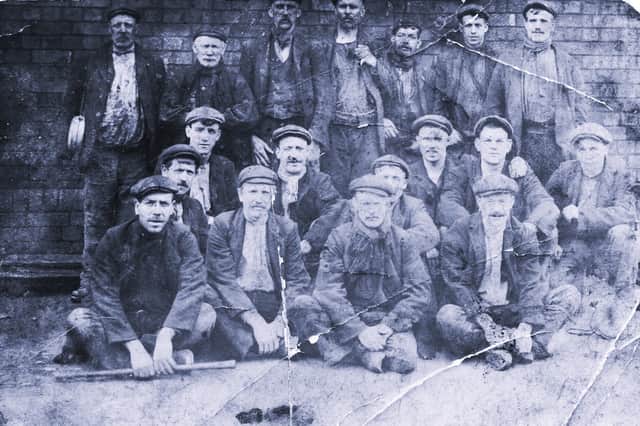 Local miners posing for a group photo
