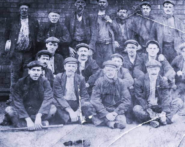 Local miners posing for a group photo