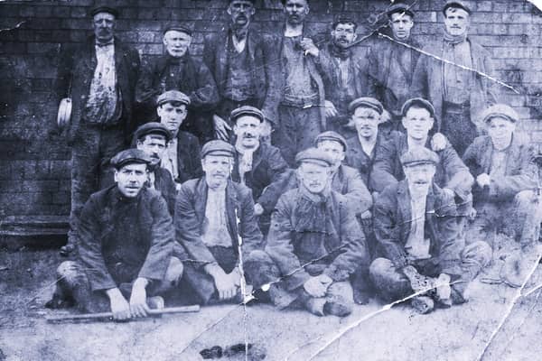 Local miners posing for a group photo