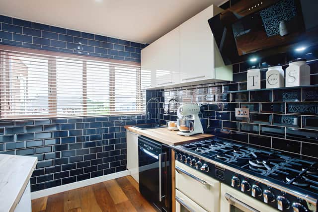 The fitted kitchen connects naturally with the separate dining room while balancing style and practicality