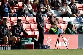 Rotherham United boss Alex Bruce watches proceedings at sunny Fleetwood Town.