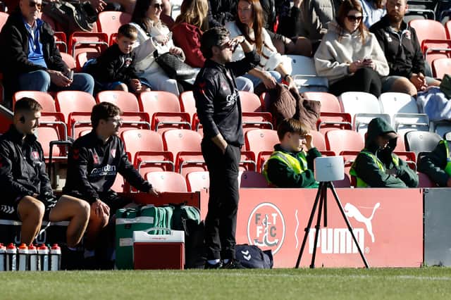 Rotherham United boss Alex Bruce watches proceedings at sunny Fleetwood Town.