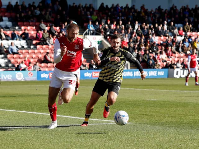 Tom Bradshaw chases down the ball for Rotherham United at Fleetwood Town