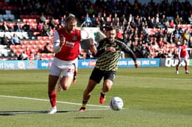Tom Bradshaw chases down the ball for Rotherham United at Fleetwood Town