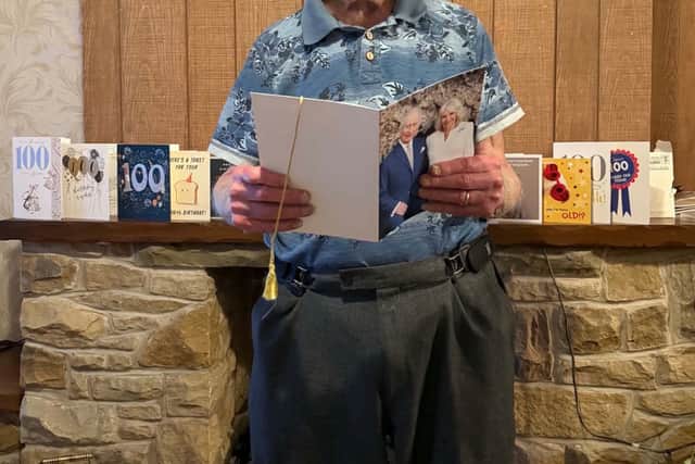 Dennis with his card from the King
