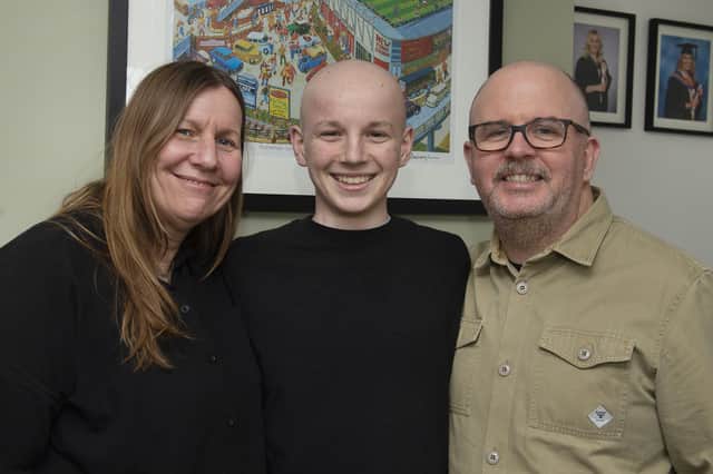 Owen Jenkinson at his Whiston home with his parents Andrea and Bill