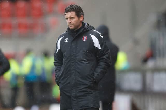 Alex Bruce watches Rotherham United against Shrewsbury Town in the rain