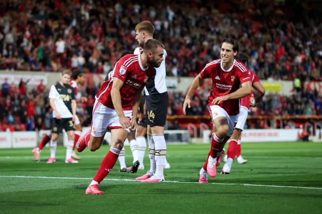 Aaron Drinan scores a goal for Swindon Town who are Rotherham United's next opponents
