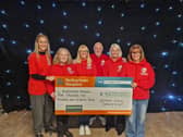 (L-R) Jamie Mitchell from Rotherham Hospice, Abbie Parkin from Wickerlsey Club, Dawn and Carl Lucock, Paws to Hooves' Diane Blackham and Debbie Houghton from Barnardo's 