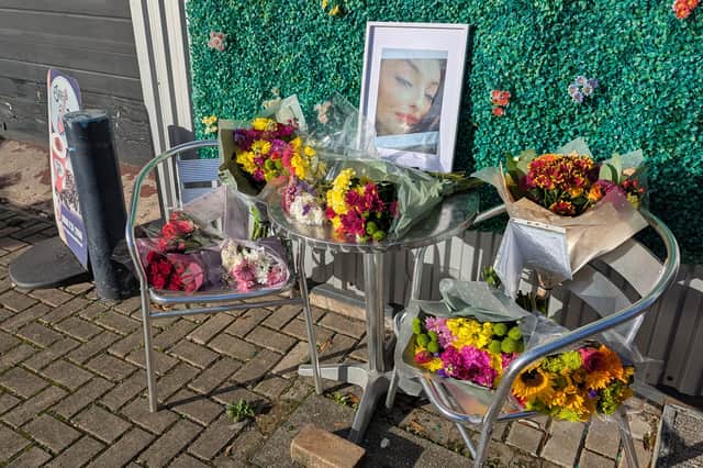 Well wishers have begun to leave floral tributes to Sophie at her family's café