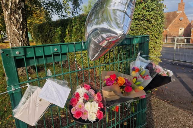 Tributes laid at the school gates to Mrs Booth