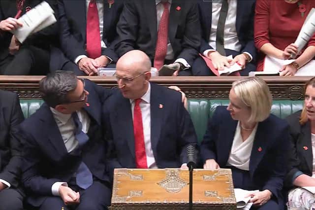 Prime Minister Andy Burnham congratulating Chancellor of the Exchequer John Healey after delivering his Budget in the House of Commons