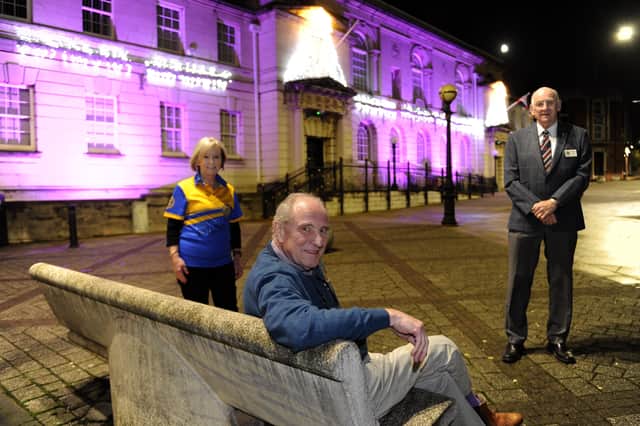 Rotherham Sitwell Rotary Club lit up Rotherham Town Hall in purple to highlight National Polio Awareness Week in February 2021. Pictured (from left to right) are then President, Trish Lister, then assistant governor of Rotary District 1220 and polio ambassador John Box, and then Chair of foundation and International for Rotherham Sitwell Rotary, Chris Croker