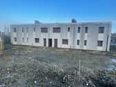 Outline planning permission was granted in September 2025 to demolish two blocks of housing, known locally as the derelicts.