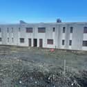 Outline planning permission was granted in September 2025 to demolish two blocks of housing, known locally as the derelicts.