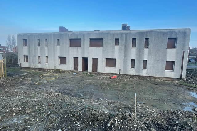 Outline planning permission was granted in September 2025 to demolish two blocks of housing, known locally as the derelicts.