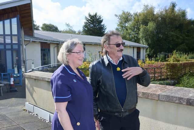Paul Chuckle with a nurse at Marie Curie in Glasgow