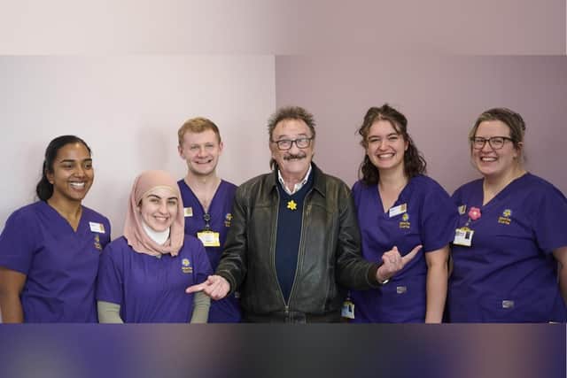 Paul Chuckle with staff at Marie Curie in Glasgow