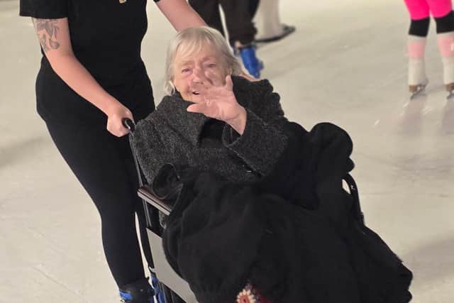 Courtney pushing Betty on the ice