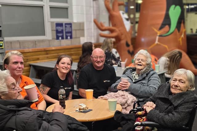 The ladies warming up with a cup of tea