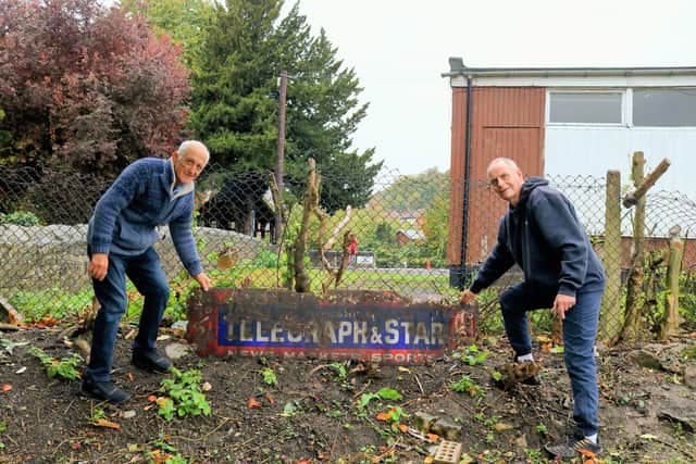 Keith Twiss and Alan Bews discovered the vintage sign whilst clearing Mr Twiss' garden