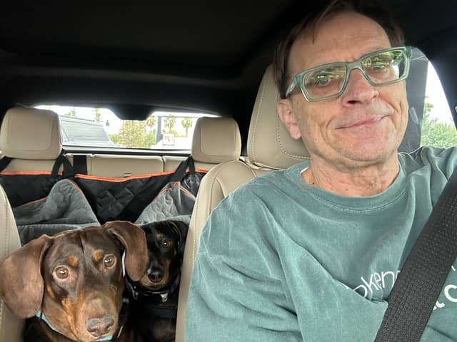Carl, pictured with pups Stevie and Jinx, will hop on a non-stop flight to London this week