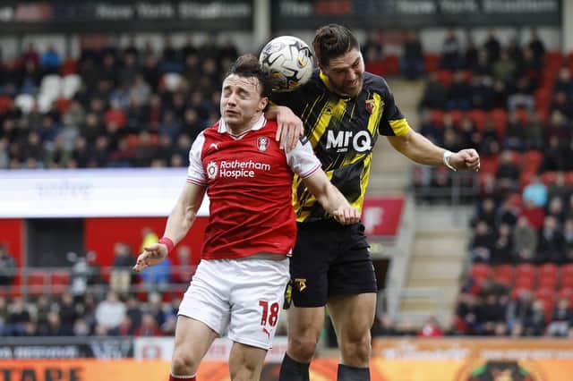 BUSY: Ollie Rathbone fronts up against Watford.