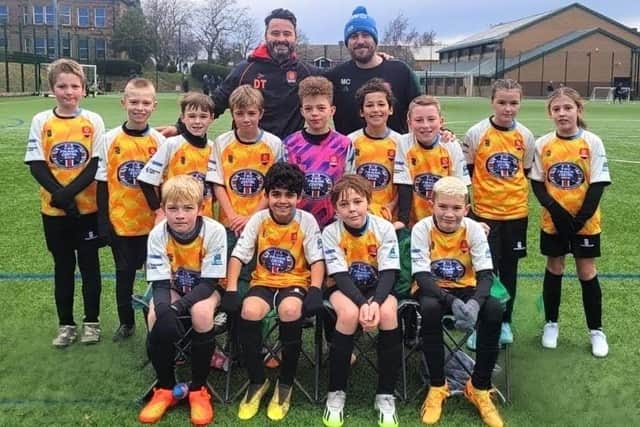 Mat, stepson Theo and his Thurcroft U11s team including his fellow coach Dan Troop.